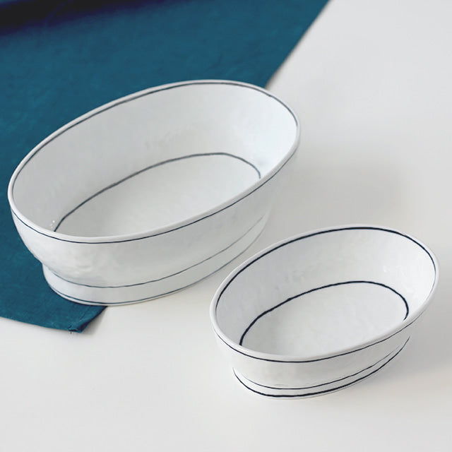 Footed crescent-shaped bowl