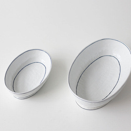 Footed crescent-shaped bowl